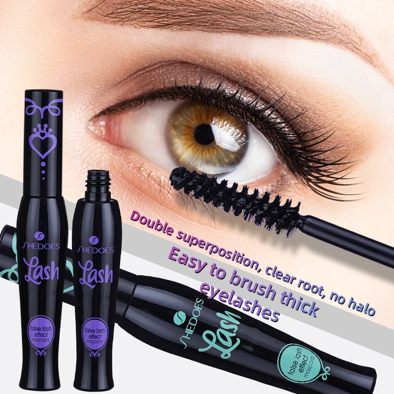 Mascara with applicator and 'SheDoes' branding, close-up of eye with mascara application.